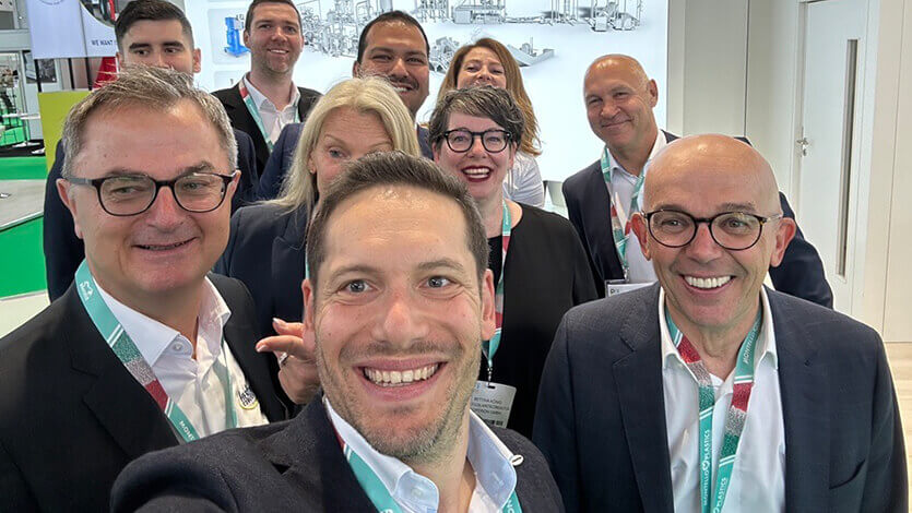 Group of Coperion employees at trade show