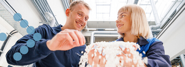 Header image Coperion employees with plastics pellets at test center