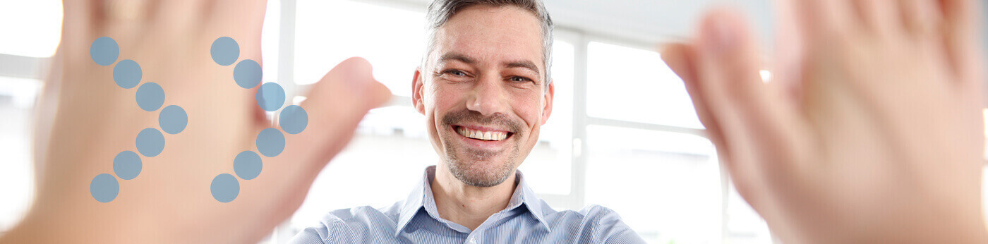 smiling professional giving high five at work